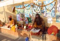 Hindu piligrim sadhu praying on the street in India