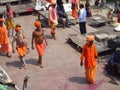 Hindu piligrims in orange clothes in Varanasi