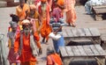 Hindu piligrims in orange clothes in Varanasi