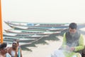 Hindu priest performing religious rituals at Ganges river bank in Varanasi, India