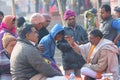 Hindu priest performing religious rituals at Ganges river bank in Varanasi, India