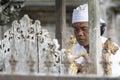 Hindu priest prays in Balinese Tirta Empul Temple Royalty Free Stock Photo