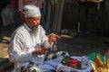 Hindu priest wearing a white uniform was carrying out a religious ceremony with a melodious chime and a beautiful and peaceful