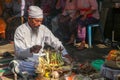 Hindu priest wearing a white uniform was carrying out a religious ceremony with a melodious chime and a beautiful and peaceful