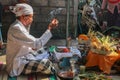 Hindu priest wearing a white uniform was carrying out a religious ceremony with a melodious chime and a beautiful and peaceful