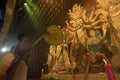 Hindu Priest worshipping Goddess Durga with big hand held fan. Ashtami puja aarati at night. Durga puja is unesco intangible Royalty Free Stock Photo