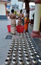 Hindu priests at temple prepare offering to gods Royalty Free Stock Photo