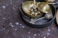 Hindu puja ritual items made of brass and other metals kept together. Kasar or gong bell, ghanta musical instruments and panch