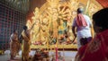 Hindu Purohits worshipping Goddess Durga with puja ingredients