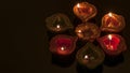 Hindu religion and Indian celebration of Diwali festival concept with group of burning clay diyas, which are festive oil lamps