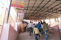 Faithful Devotees climb steep steps to temple on pilgrimage in India Royalty Free Stock Photo