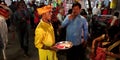 hindu religious man showing lamp during dussehra road show in India