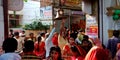 hindu religious people ringing devotional well into the temple entrance gate during navratri festival in india oct 2019