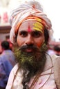 Hindu sadhu with face fully smeared with colours