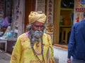 Hindu religion saint, monk or Sadhu. Indian Holy man roaming in street market of rural village