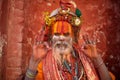 Hindu Saint happily posing for a photo Royalty Free Stock Photo