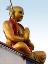 Hindu saint ramanuja in greeting or prayer pose,against blue sky, in a temple