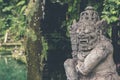 Hindu stone statue in the balinese temple. Tropical island of Bali, Indonesia. Royalty Free Stock Photo