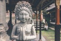 Hindu stone statue in the balinese temple. Tropical island of Bali, Indonesia. Royalty Free Stock Photo