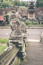 Hindu stone statue in the balinese temple. Tropical island of Bali, Indonesia. Royalty Free Stock Photo