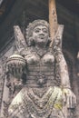 Hindu stone statue in the balinese temple. Tropical island of Bali, Indonesia. Royalty Free Stock Photo