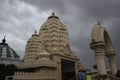 A hindu temple located in Mathura against dramatic black cloud