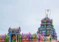 A hindu temple with vibrant and colorful sculptures