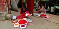 Hindu traditional woman selling vermilion powder while seating on stair at maihar temple in India aug 2019 Royalty Free Stock Photo