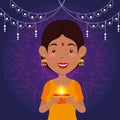 Hindu woman with candle and lights hanging