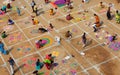 Hindu woman draw rangoli with colored powders,flowers in pongal or makara sankranti festiva Royalty Free Stock Photo