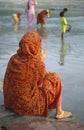 Rishikesh, India, Hindu woman in prayer beside River Ganges