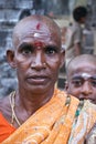 Hindu woman with shaven head