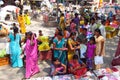 Hindu women dressed in colorful sari in Indian street market