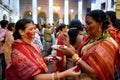 Hindu women painting faces with red powder Royalty Free Stock Photo