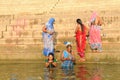 Hindu women taking a ritual bath in the holy Ganges River