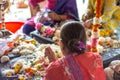 Hindu women weaving flower garlands at ISKCON Delhi Hindu temple Royalty Free Stock Photo