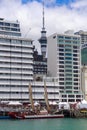 Traditional Maori waka in front of city skyline, Auckland, New Zealand