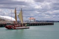 Double-hulled Maori waka in Auckland Harbour, New Zealand