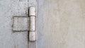 The hinge on an old rusty iron door is painted gray, close-up. garage door hinge. Copy space Royalty Free Stock Photo