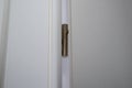 Hinge in the white wooden door Royalty Free Stock Photo