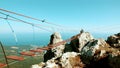 A hinged bridge high in the mountains of Crimea Ai-Petri. The sea in the background Vertical photo