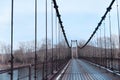 Hinged bridge through the Katun river in Altai . Bridge going into perspective Royalty Free Stock Photo