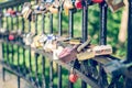 Hinged love locks hanging on a bridge Royalty Free Stock Photo