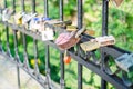 Hinged love locks hanging on a bridge Royalty Free Stock Photo