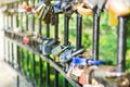 Hinged love locks hanging on a bridge Royalty Free Stock Photo