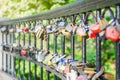 Hinged love locks hanging on a bridge Royalty Free Stock Photo