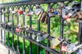 Hinged love locks hanging on a bridge Royalty Free Stock Photo