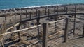 hinged wooden bridge on a background of beautiful sea waves in sunny weather.