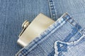 Hip flask in denim jeans pocket