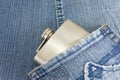 Hip flask in denim jeans pocket